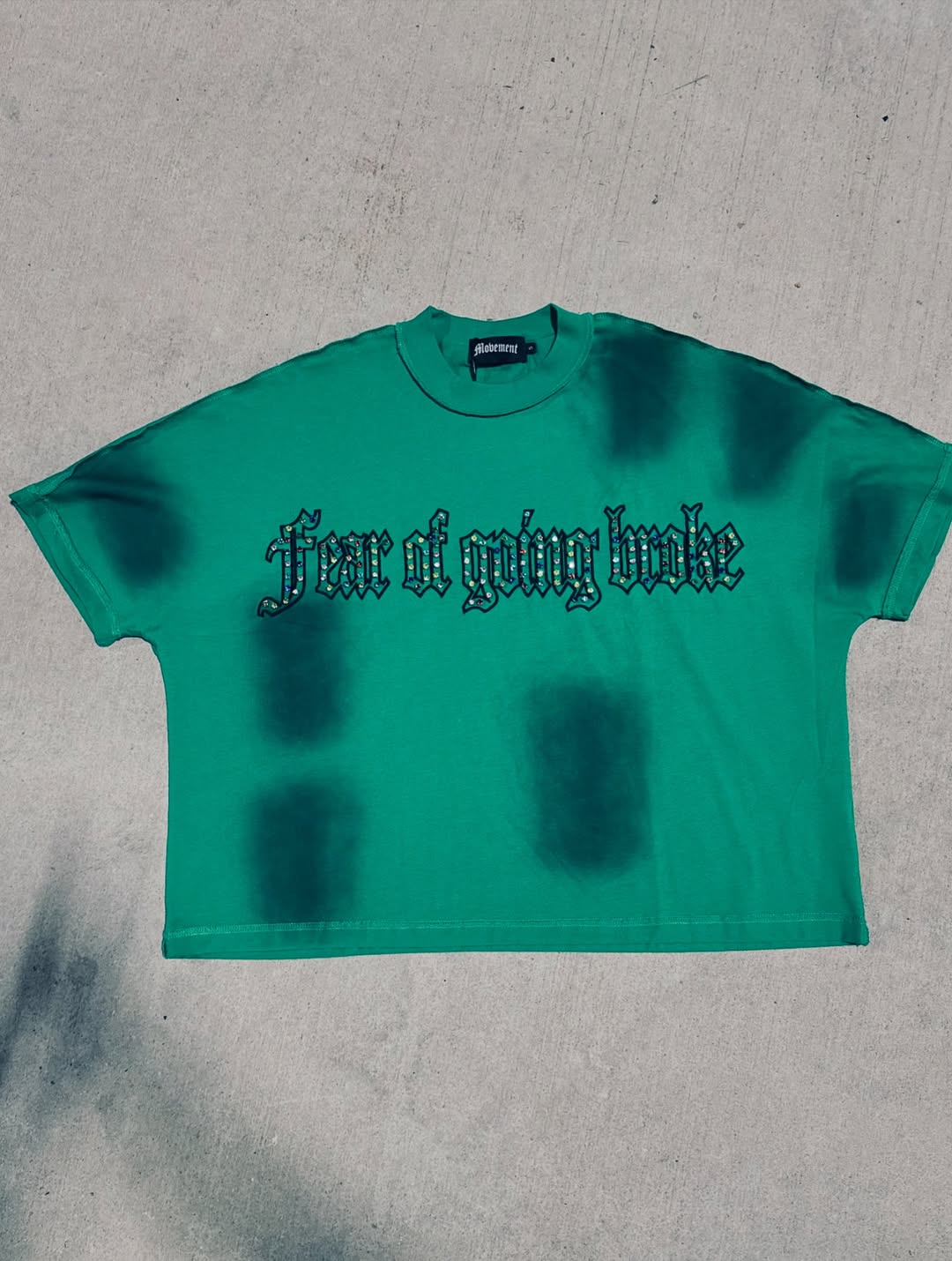 Green rivet stone tee